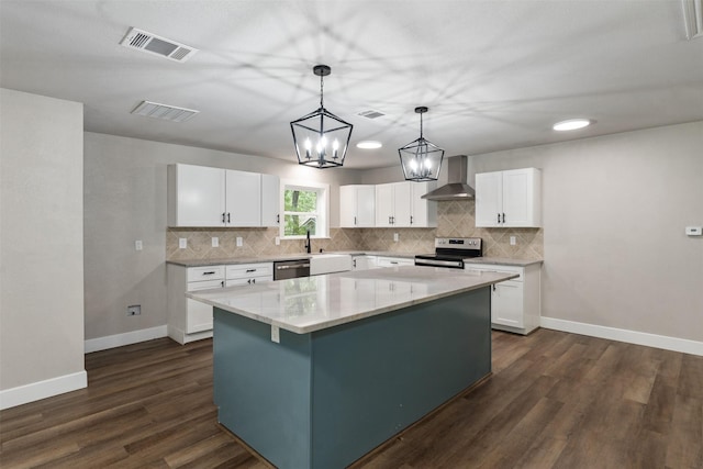 147 Carolynn Rd, Mabank, TX 75156 - kitchen with wall chimney exhaust hood, stainless steel appliances, decorative backsplash, and white cabinetry
