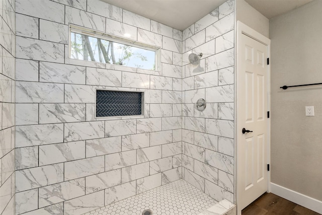 147 Carolynn Rd, Mabank, TX 75156 - full bathroom featuring a tile shower, wood finished floors, and baseboards