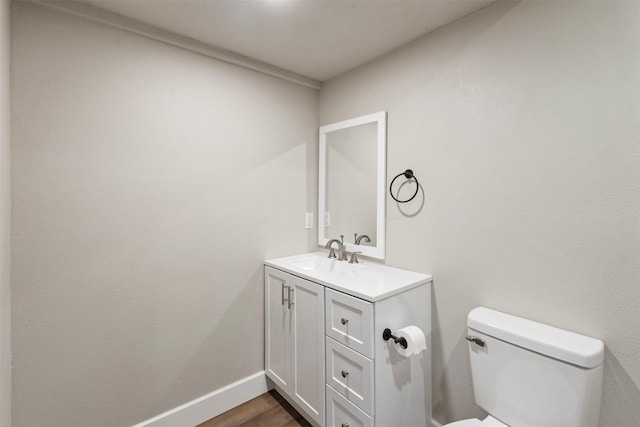 147 Carolynn Rd, Mabank, TX 75156 - half bath featuring vanity, toilet, baseboards, and wood finished floors