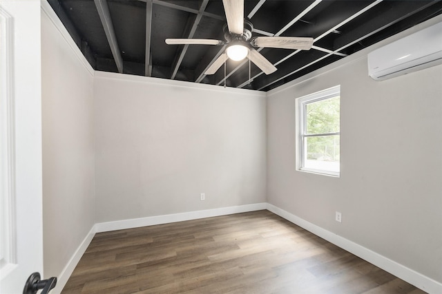 147 Carolynn Rd, Mabank, TX 75156 - spare room featuring a wall mounted air conditioner, ceiling fan, baseboards, and wood finished floors