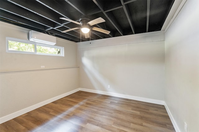 147 Carolynn Rd, Mabank, TX 75156 - spare room with an AC wall unit, a ceiling fan, and baseboards
