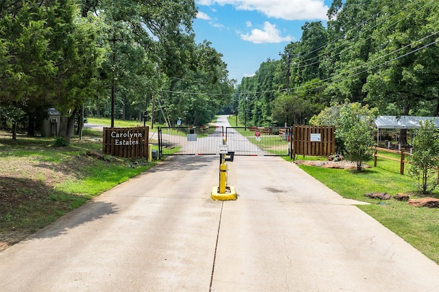 147 Carolynn Rd, Mabank, TX 75156 - view of concrete road featuring a gate and a gated entry