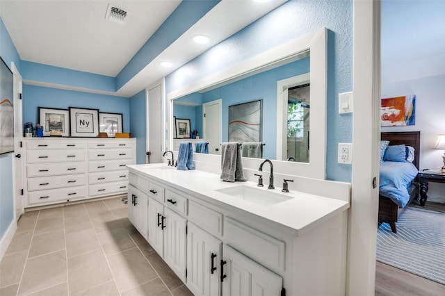 1905 Red Cypress Ct, Arlington, TX 76012 - bathroom featuring ensuite bathroom, double vanity, recessed lighting, and tile patterned flooring