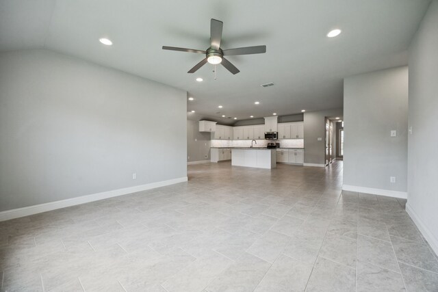129 Braves Way, Lavon, TX 75166 - unfurnished living room with ceiling fan, recessed lighting, baseboards, and a sink