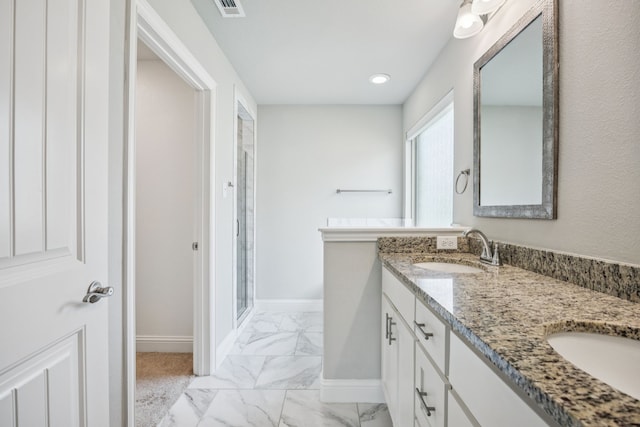 129 Braves Way, Lavon, TX 75166 - bathroom featuring marble look tile flooring, baseboards, double vanity, a stall shower, and recessed lighting