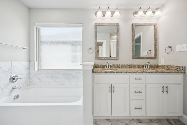 129 Braves Way, Lavon, TX 75166 - full bathroom featuring double vanity, a bath, and marble finish flooring