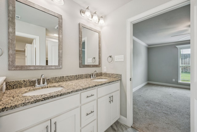 129 Braves Way, Lavon, TX 75166 - full bathroom with double vanity, crown molding, and baseboards