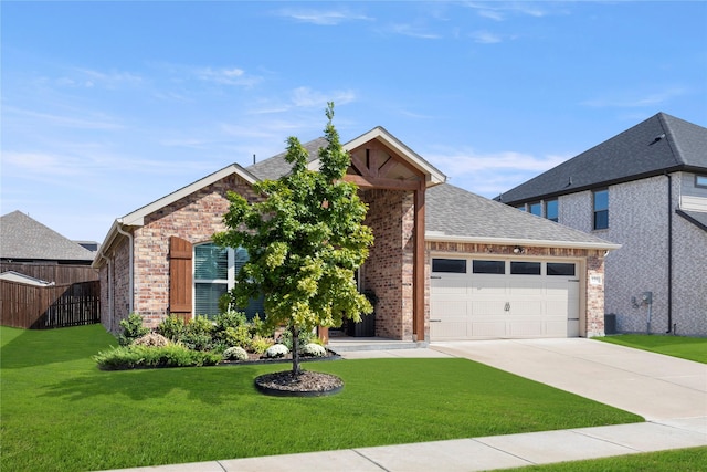 129 Braves Way, Lavon, TX 75166 - view of front of house featuring brick siding, an attached garage, concrete driveway, and roof with shingles