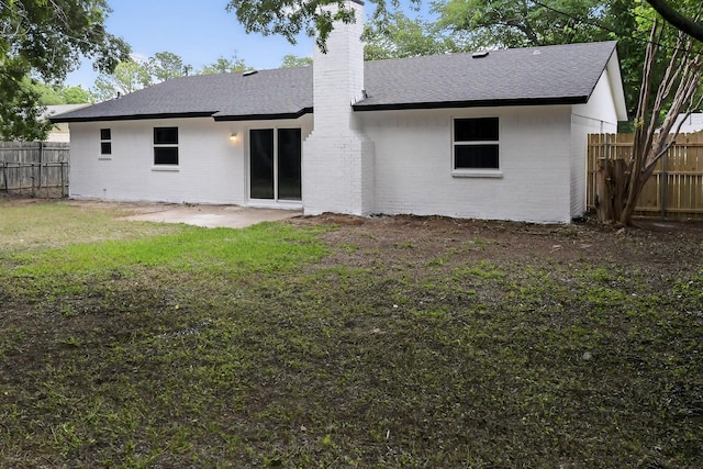 6821 Mickey Dr, Watauga, TX 76148 - rear view of property featuring a chimney, brick siding, roof with shingles, and a patio