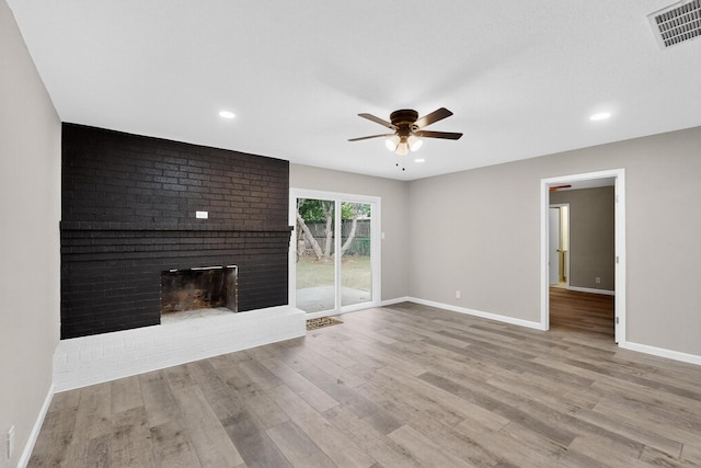 6821 Mickey Dr, Watauga, TX 76148 - unfurnished living room with ceiling fan, baseboards, wood finished floors, a brick fireplace, and recessed lighting