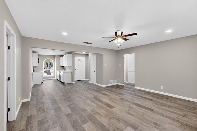 6821 Mickey Dr, Watauga, TX 76148 - unfurnished living room with ceiling fan, wood finished floors, baseboards, and recessed lighting