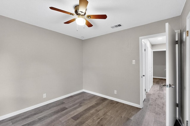 6821 Mickey Dr, Watauga, TX 76148 - empty room featuring ceiling fan, dark wood-style floors, and baseboards