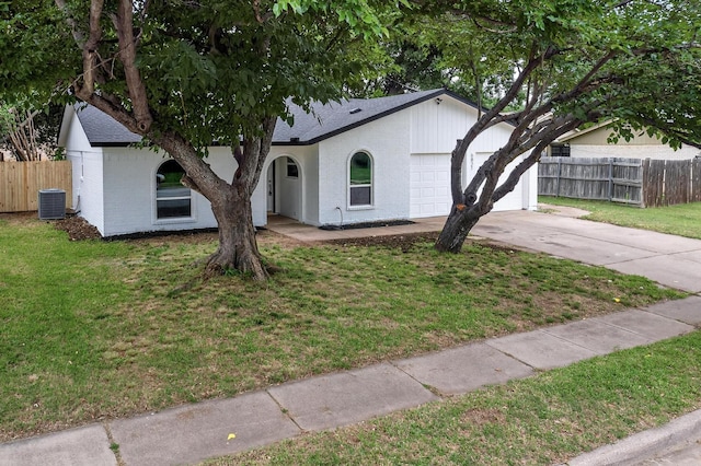 6821 Mickey Dr, Watauga, TX 76148 - ranch-style house with a garage, cooling unit, a shingled roof, driveway, and brick siding