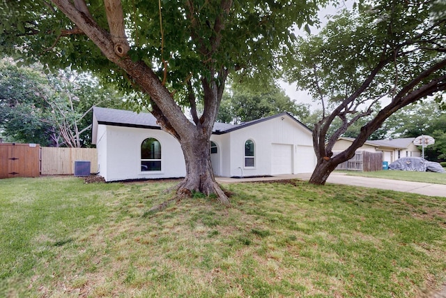 6821 Mickey Dr, Watauga, TX 76148 - ranch-style house featuring an attached garage, concrete driveway, a gate, stucco siding, and central AC