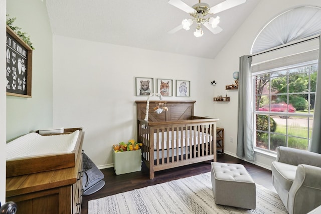 7314 Glenstone St, Rowlett, TX 75089 - bedroom featuring vaulted ceiling, a crib, multiple windows, and wood finished floors