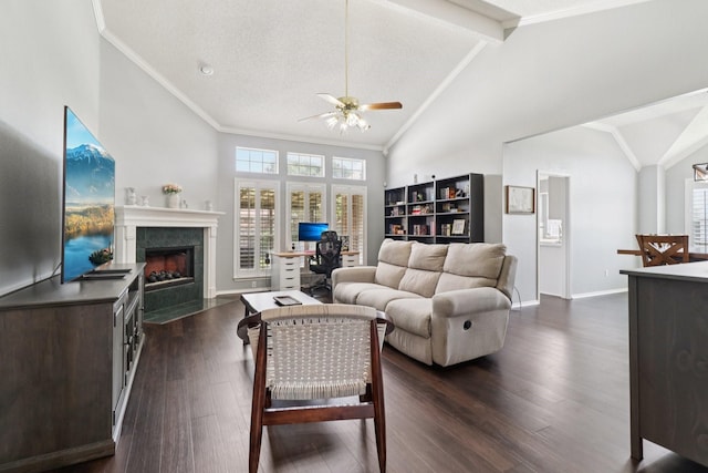 7314 Glenstone St, Rowlett, TX 75089 - living room featuring a ceiling fan, a tile fireplace, plenty of natural light, dark wood-style floors, and ornamental molding
