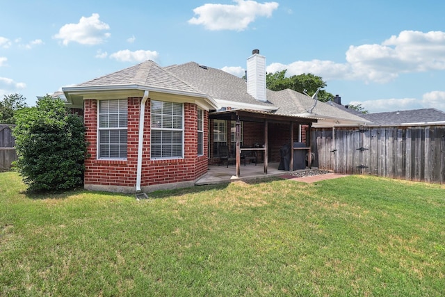 7314 Glenstone St, Rowlett, TX 75089 - back of property with brick siding, a patio area, a chimney, and a shingled roof