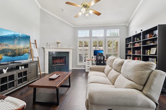 7314 Glenstone St, Rowlett, TX 75089 - living room with crown molding, a ceiling fan, a tiled fireplace, a textured ceiling, and wood finished floors