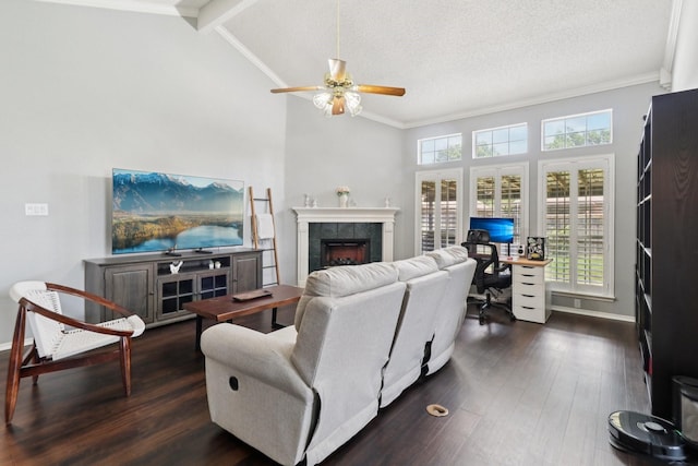 7314 Glenstone St, Rowlett, TX 75089 - living room featuring an office area, a ceiling fan, a tile fireplace, dark wood-style floors, and baseboards