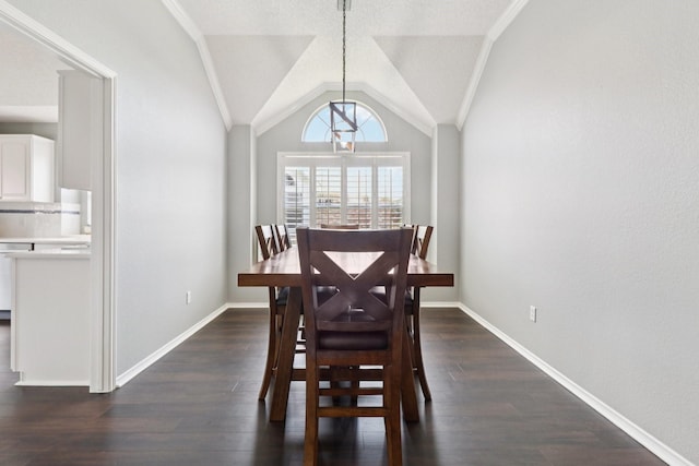 7314 Glenstone St, Rowlett, TX 75089 - dining room featuring dark wood-style floors, lofted ceiling, baseboards, and ornamental molding