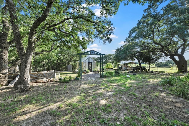 1200 Old Decatur Rd, Decatur, TX 76234 - view of yard with a greenhouse and an outbuilding
