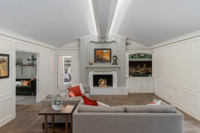 6867 Mossvine Dr, Dallas, TX 75254 - living room featuring a decorative wall, a fireplace, vaulted ceiling, and ornamental molding