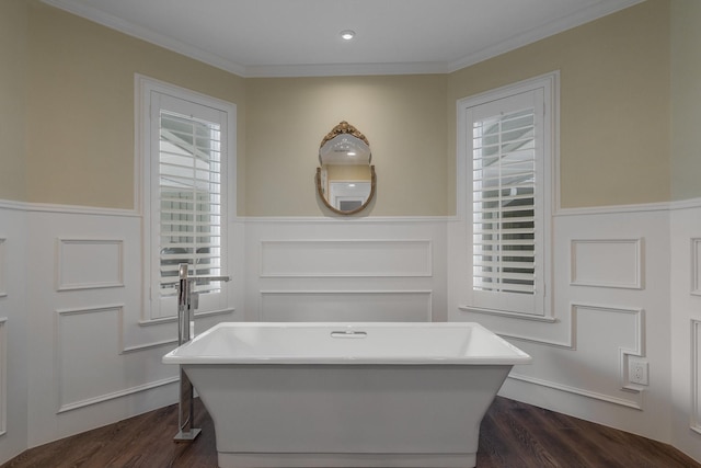 6867 Mossvine Dr, Dallas, TX 75254 - full bath featuring wainscoting, a freestanding bath, crown molding, and wood finished floors