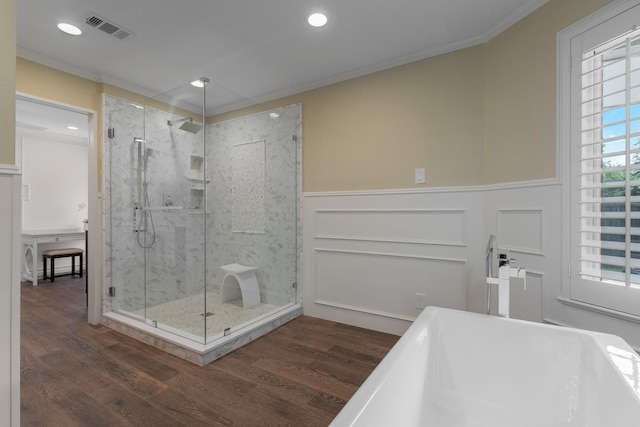 6867 Mossvine Dr, Dallas, TX 75254 - full bath featuring a freestanding tub, a marble finish shower, wood finished floors, wainscoting, and ornamental molding