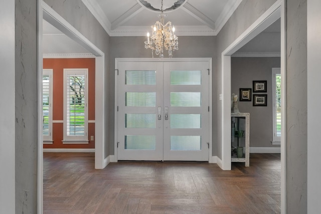 6867 Mossvine Dr, Dallas, TX 75254 - entrance foyer with french doors, a chandelier, crown molding, and baseboards