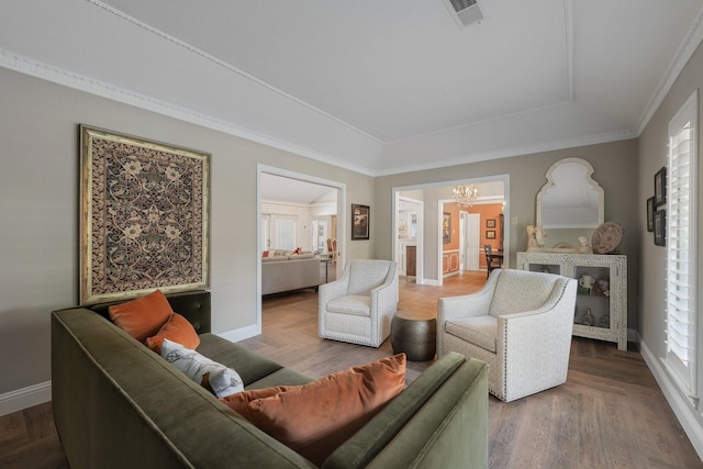 6867 Mossvine Dr, Dallas, TX 75254 - living area with a chandelier, a tray ceiling, baseboards, and ornamental molding