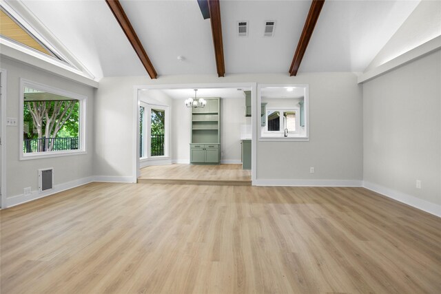 5305 Links Dr, Waco, TX 76708 - unfurnished living room featuring a chandelier, plenty of natural light, light wood-style floors, and baseboards