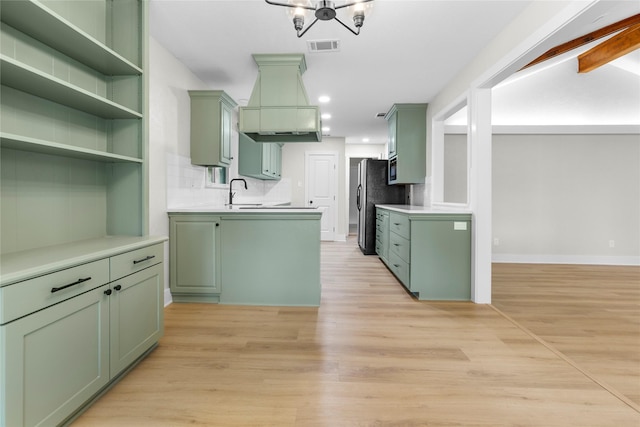 5305 Links Dr, Waco, TX 76708 - kitchen featuring green cabinets, recessed lighting, light wood finished floors, and light countertops