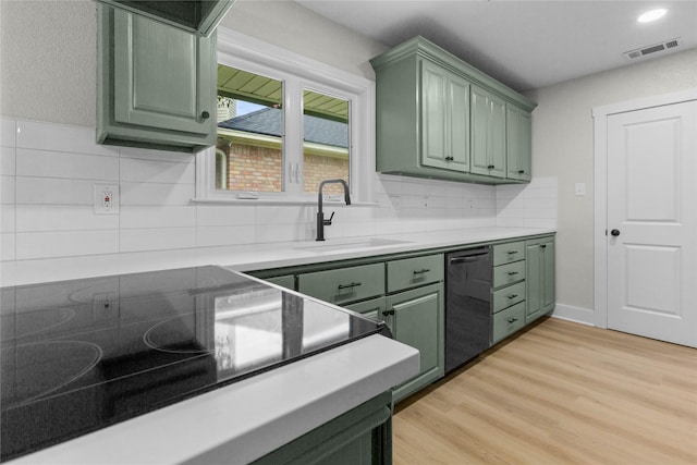 5305 Links Dr, Waco, TX 76708 - kitchen featuring green cabinetry, a sink, dishwasher, light countertops, and recessed lighting