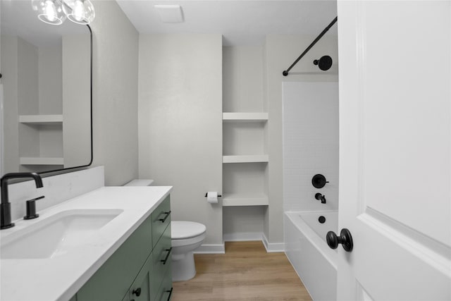5305 Links Dr, Waco, TX 76708 - bathroom featuring wood finished floors, vanity, toilet, and bathtub / shower combination