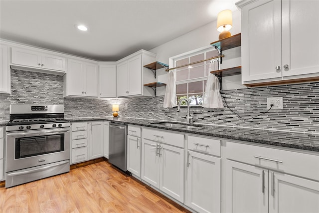 201 W Tinsley Dr, Robinson, TX 76706 - kitchen with open shelves, stainless steel appliances, a sink, white cabinetry, and dark stone countertops