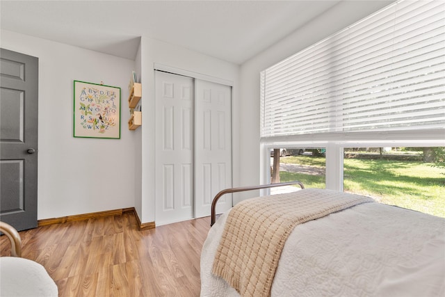 201 W Tinsley Dr, Robinson, TX 76706 - bedroom with baseboards, light wood-type flooring, and a closet