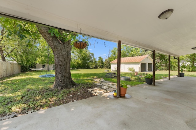 201 W Tinsley Dr, Robinson, TX 76706 - view of patio featuring an outbuilding and a trampoline