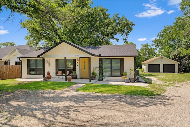 201 W Tinsley Dr, Robinson, TX 76706 - view of front of home featuring a garage, a shingled roof, and an outdoor structure