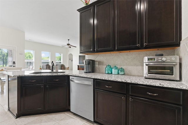2014 Autumn Dr, Glenn Heights, TX 75154 - kitchen featuring stainless steel dishwasher, a peninsula, light stone counters, and ceiling fan