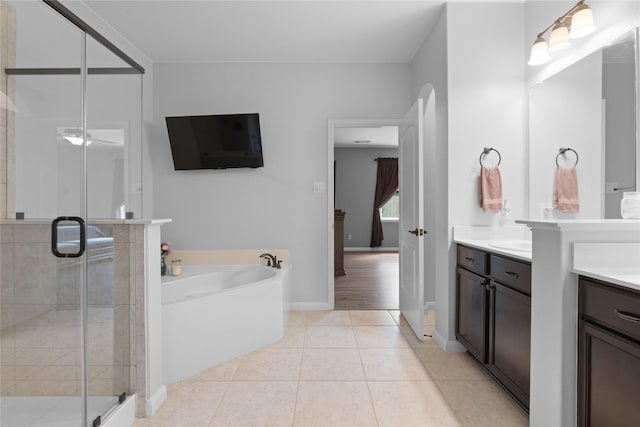 2014 Autumn Dr, Glenn Heights, TX 75154 - bathroom featuring vanity, a bath, a stall shower, and tile patterned floors
