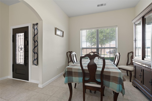 2014 Autumn Dr, Glenn Heights, TX 75154 - dining room with arched walkways, healthy amount of natural light, and light tile patterned floors