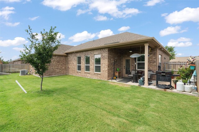 2014 Autumn Dr, Glenn Heights, TX 75154 - rear view of house featuring a fenced backyard, a patio area, brick siding, and a shingled roof