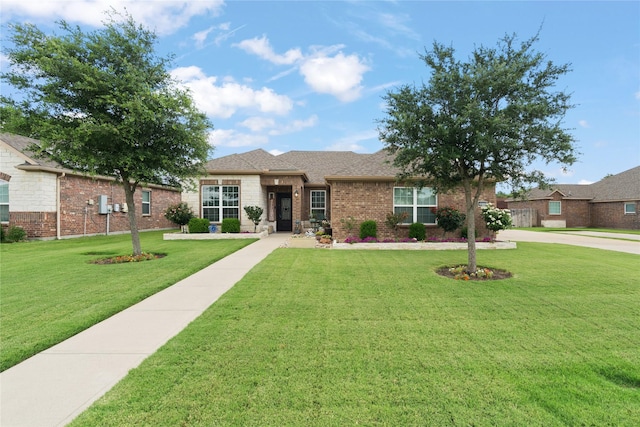 2014 Autumn Dr, Glenn Heights, TX 75154 - view of front facade featuring brick siding, a front yard, and a shingled roof