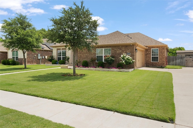 2014 Autumn Dr, Glenn Heights, TX 75154 - view of front of house with concrete driveway, brick siding, an attached garage, and a shingled roof
