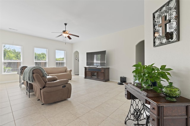 2014 Autumn Dr, Glenn Heights, TX 75154 - living room featuring arched walkways, light tile patterned flooring, and a ceiling fan