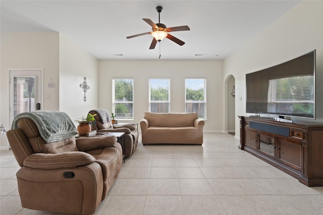 2014 Autumn Dr, Glenn Heights, TX 75154 - living area featuring arched walkways, a ceiling fan, and light tile patterned floors