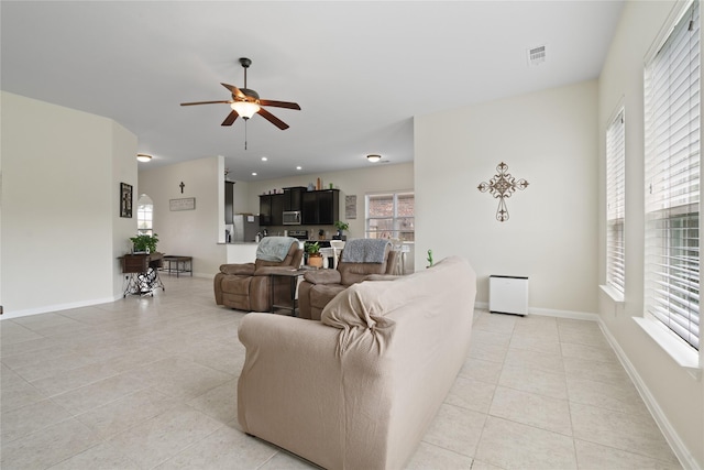 2014 Autumn Dr, Glenn Heights, TX 75154 - living area featuring light tile patterned floors and ceiling fan