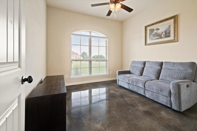 7030 Brooke Blvd, Midlothian, TX 76065 - living room featuring a ceiling fan, baseboards, and concrete floors