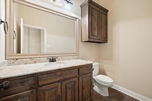 7030 Brooke Blvd, Midlothian, TX 76065 - bathroom with toilet, vanity, and baseboards