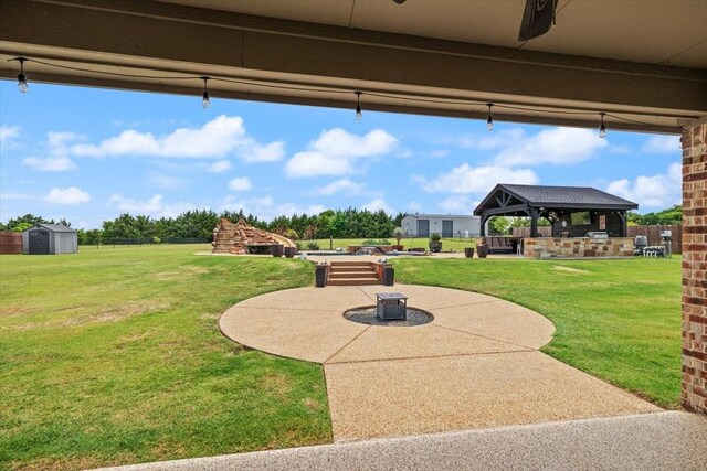 7030 Brooke Blvd, Midlothian, TX 76065 - view of green lawn with a gazebo and a patio area